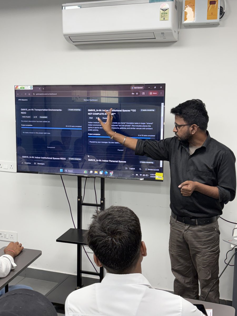 Instructor teaching on smart board at MITS Academy